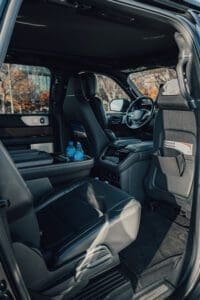 Luxury SUV interior with touch console and black leather seats – Boston Limo VIP